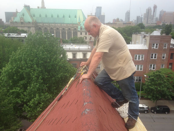 Watching Andre repair flashing on a chimney in Brooklyn, NY. Watching Andre repair flashing on a chimney in Brooklyn, NY.