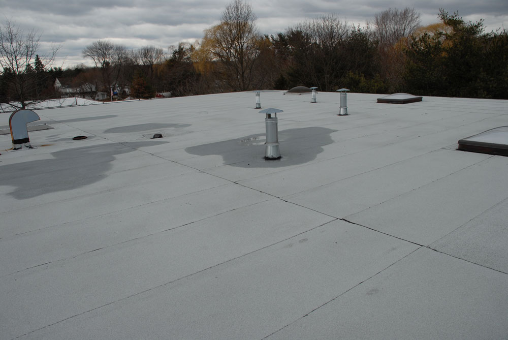 This 2 Ply Modified Bitumen Torch Down Rubber roof has not needed any repairs since its installation over 14 years ago. This 2 Ply Modified Bitumen Torch Down Rubber roof has not needed any repairs since its installation over 14 years ago.